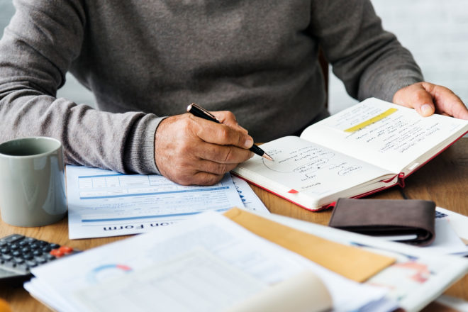 Man doing bookkeeping at table