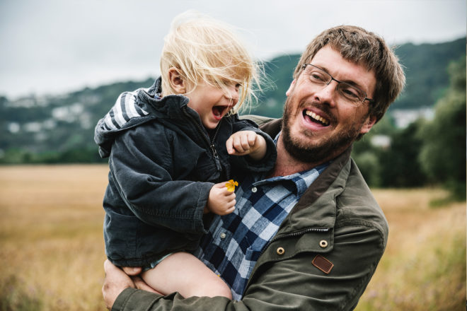 Father and son playing outside