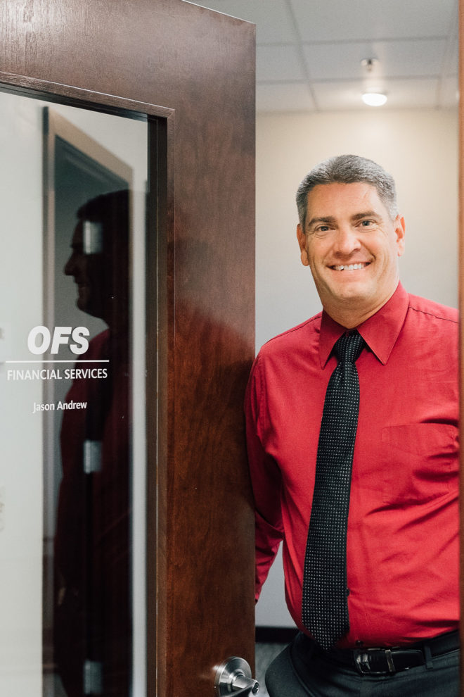 Cetera Financial Advisor Jason Andrew holding OFS Financial door open.